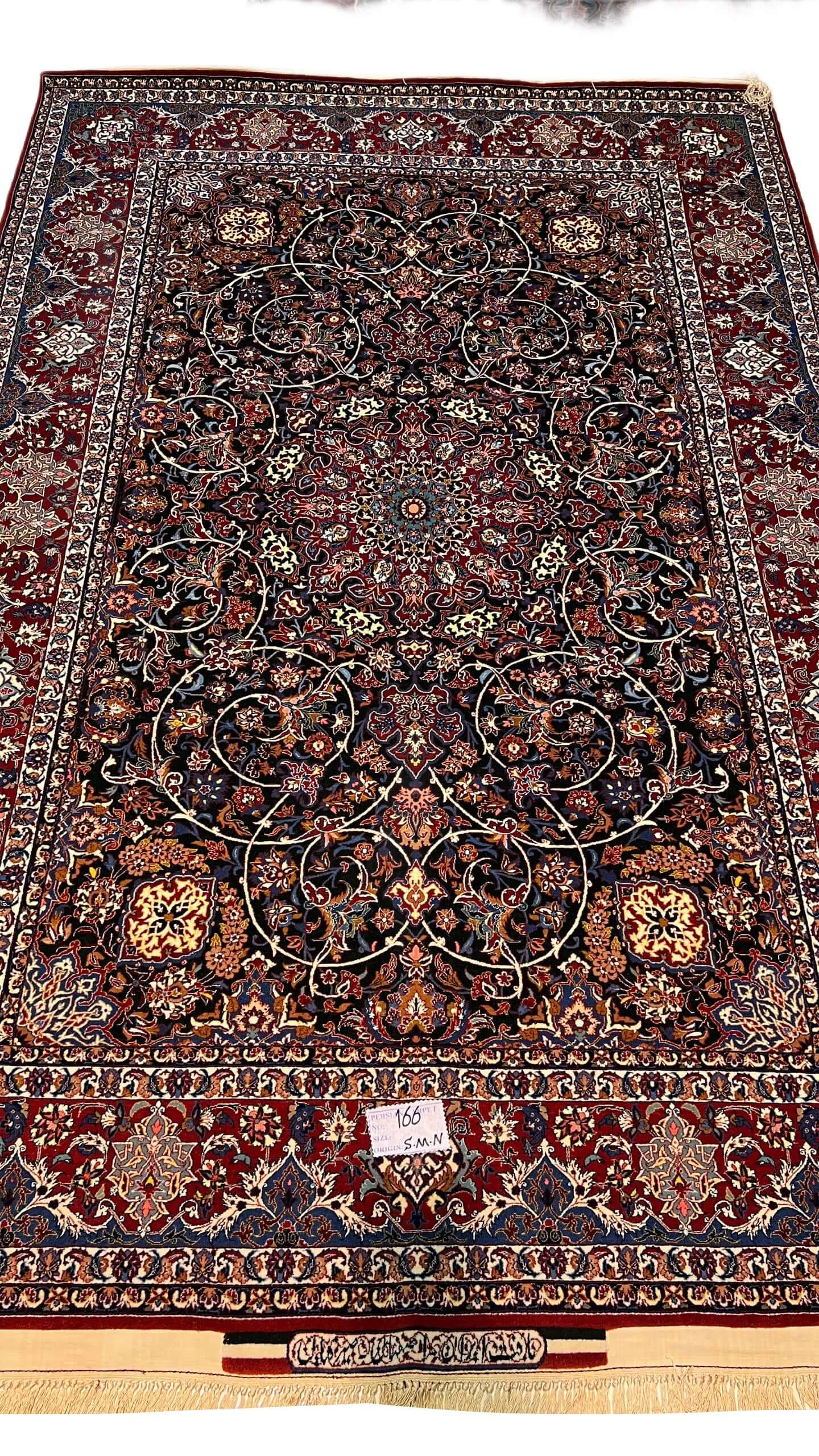"Persian rug from Isfahan, genuine Seirafian carpet in red and beige tones."